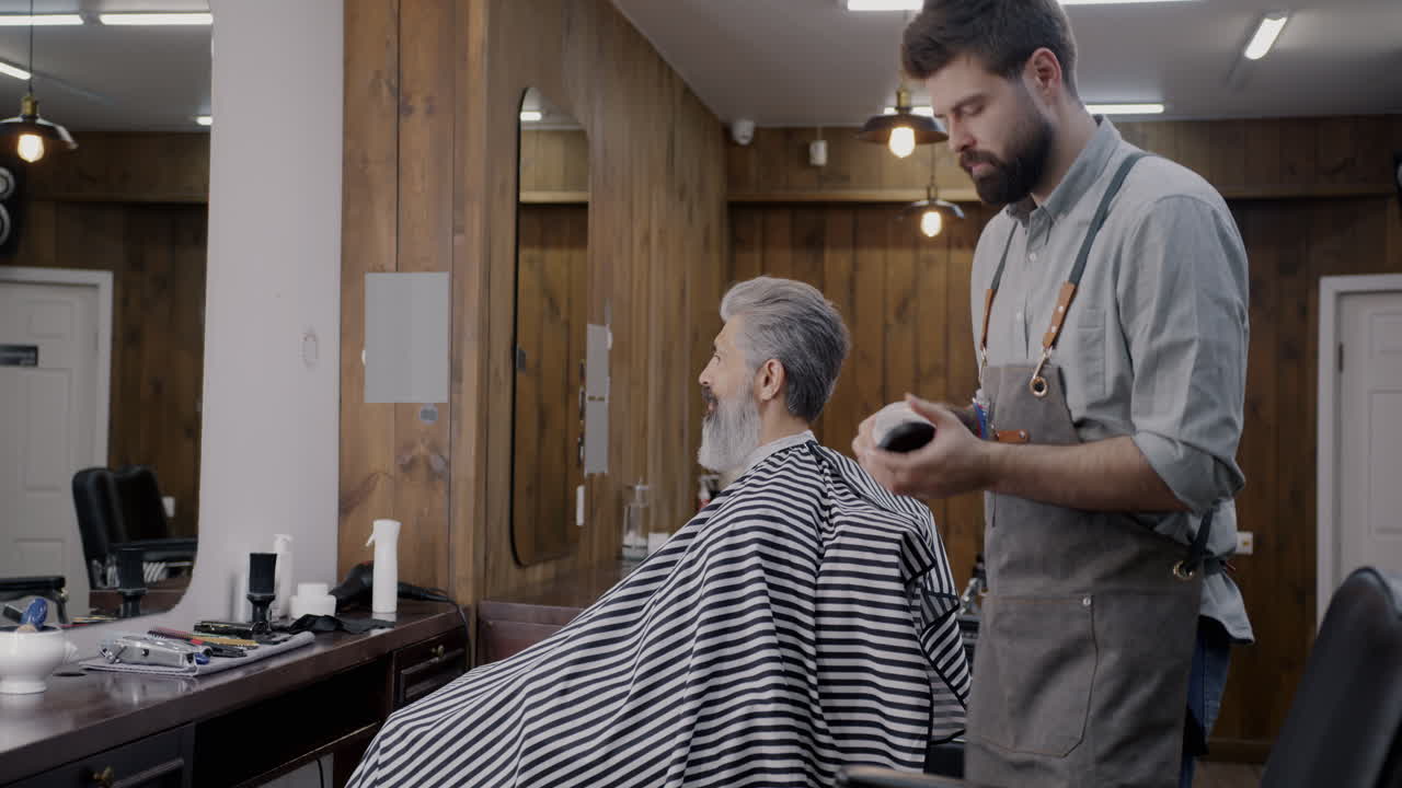 Man Getting a Haircut at the Barber Shop