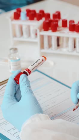 doctor prepares blood sample for analysis in a clinical setting