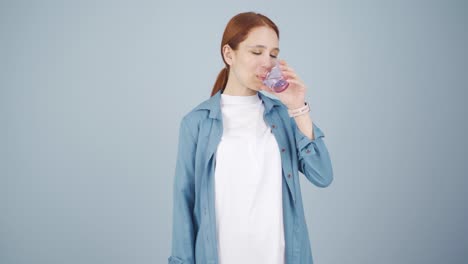 the sick woman drinks a lot of water.