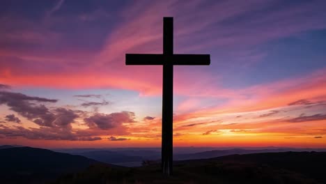 cross on mountain at sunset