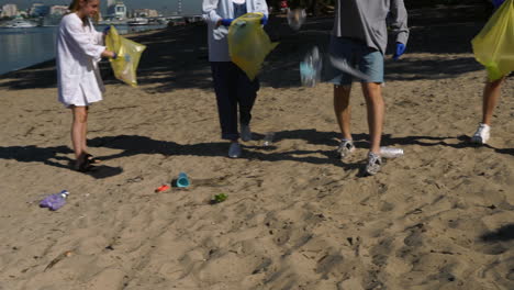 volunteers cleaning up beach litter