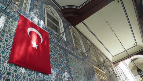 turkish historical building interior with flag and decorative tiles