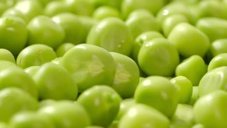 fresh green peas rotate. close up.