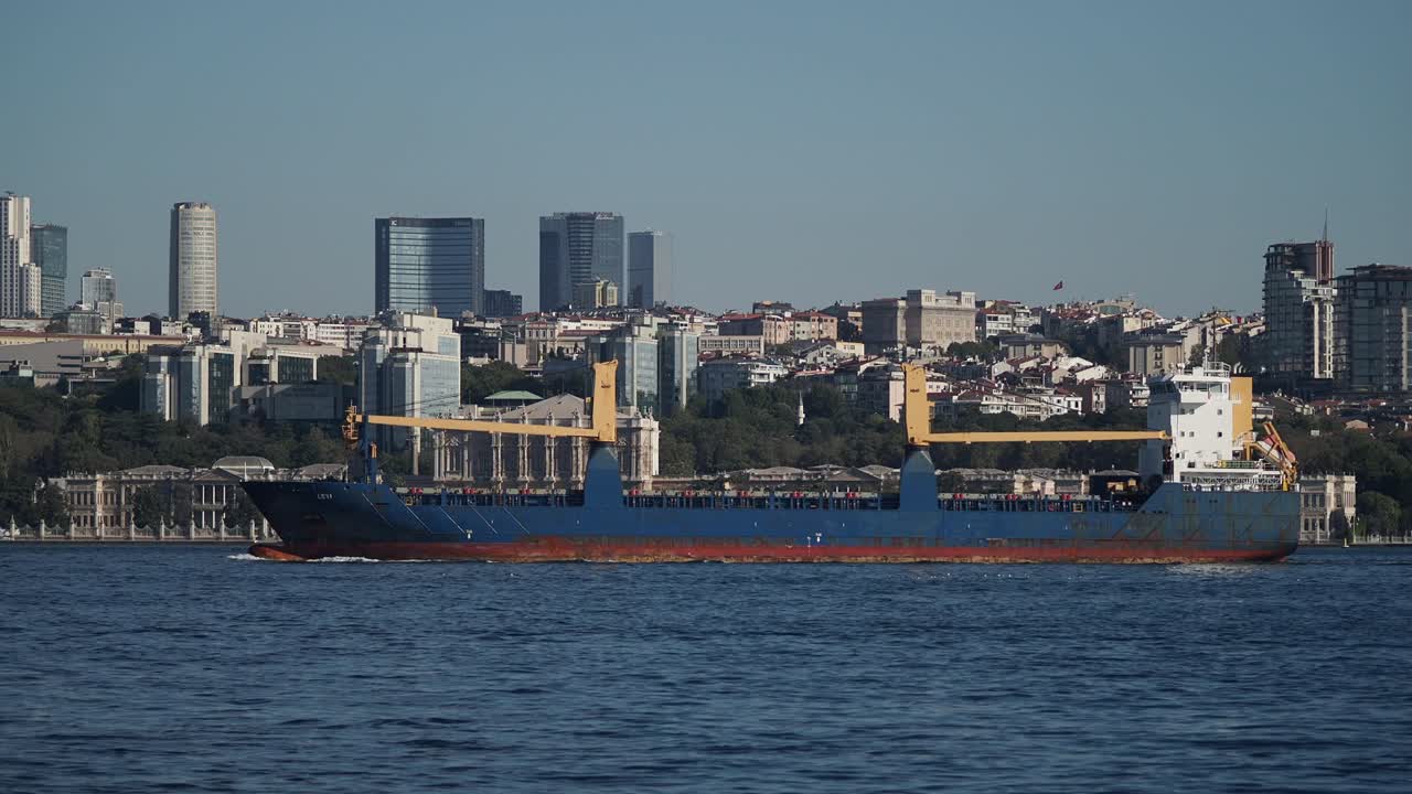 Cargo ship sailing near the city