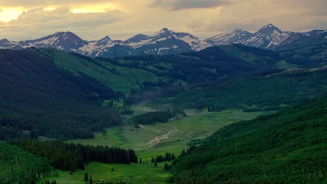 aerial of the rocky mountains under a moody sky as seen from crested butte near boulder, colorado, usa