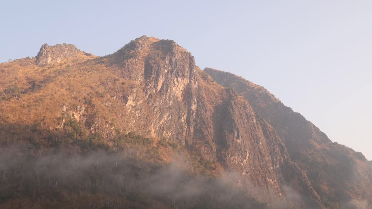 last sun light of the day glowing on the mounatin peaks in the mountain town of Nong Khiaw in Laos, Southeast Asia