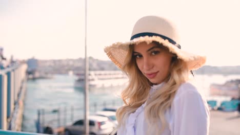 Slow-Motion:Beautiful-girl-poses-near-bosphorus-with-view-of-Galata-bridge-and-Istanbul