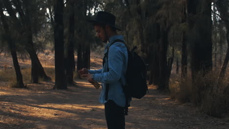 Handsome-explorer-opens-a-book-and-starts-walking