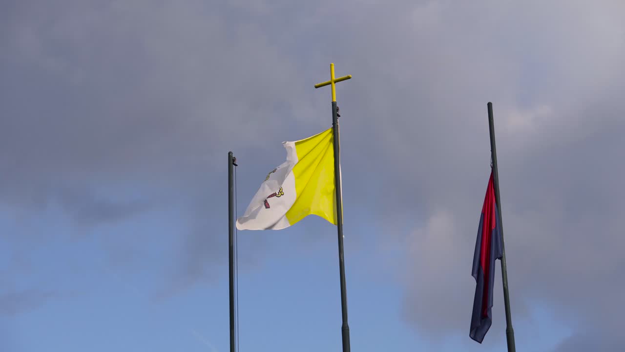 Papal flag waving in the wind