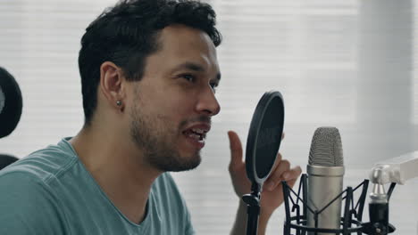 talking into microphone, close-up of person in a creative environment