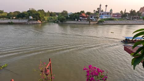 a boat travels across a scenic river view