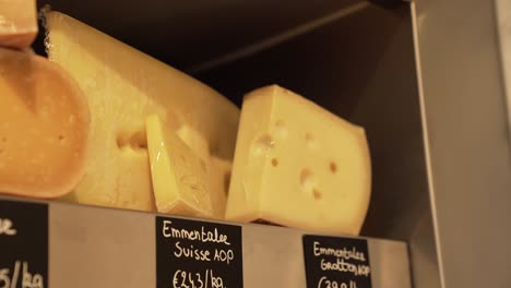 close-up of emmental swiss cheese in a cheese shop