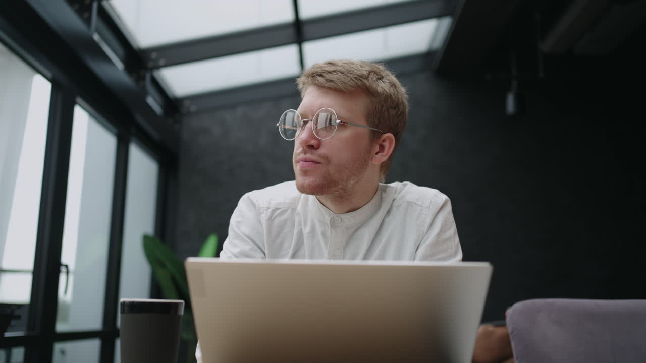 creative designer is working with laptop in office thinking about design and architecture portrait