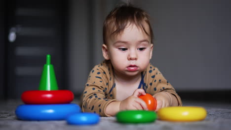 baby playing with stacking rings