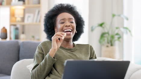 Female-with-an-afro-enjoying-a-comedy-movie