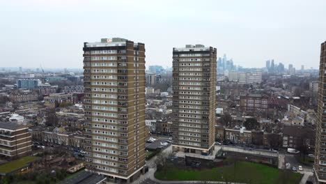 drone shot pushing in towards residential towers in london, england