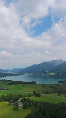 lake wolfgangsee and strobl town in the salzburg region in a vertical shot.