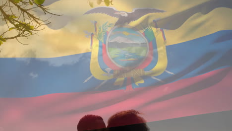 animation of ecuadorian flag over diverse couple kissing, sitting on sunny beach