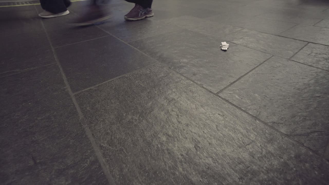 Close up shot of pathway with walking people