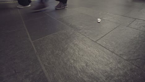 close up shot of pathway with walking people