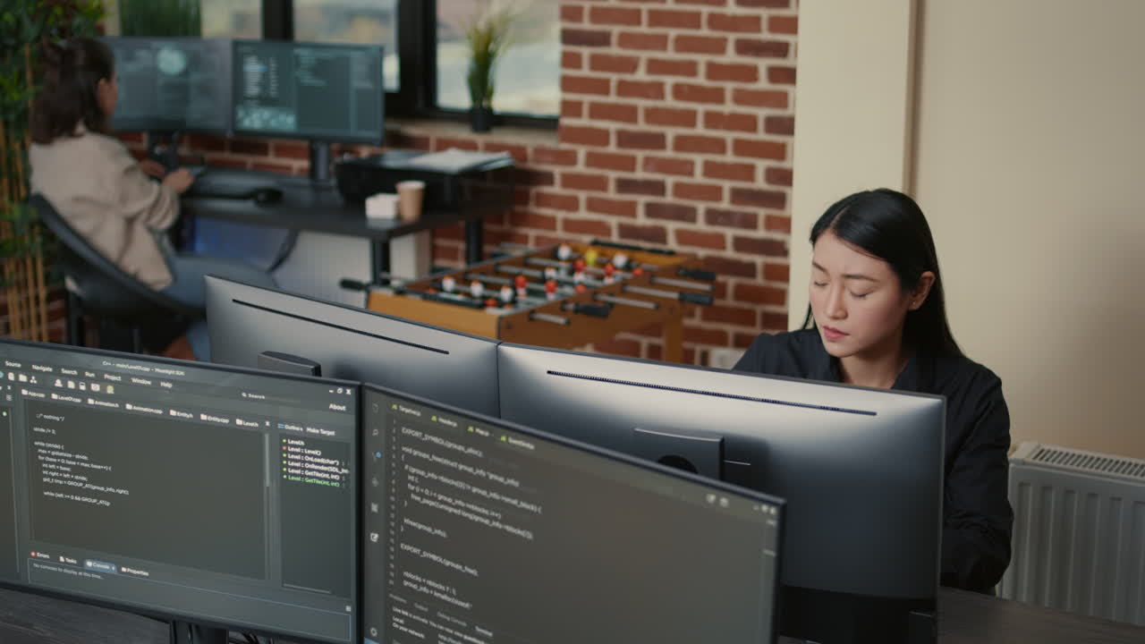 Portrait of asian programer focused on writing code encounters unexpected compiling error