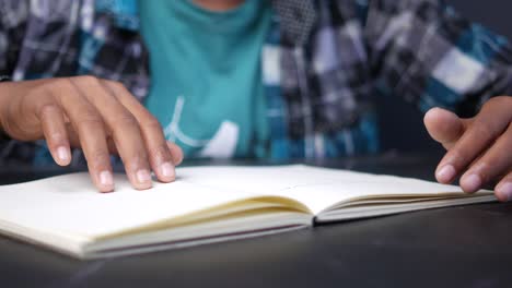 person reading an open notebook