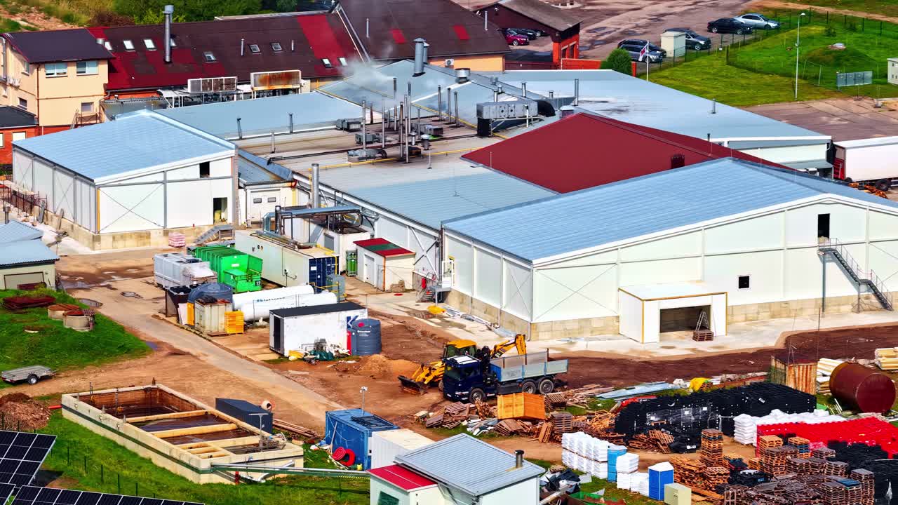 Industrial site with buildings under construction on a sunny day