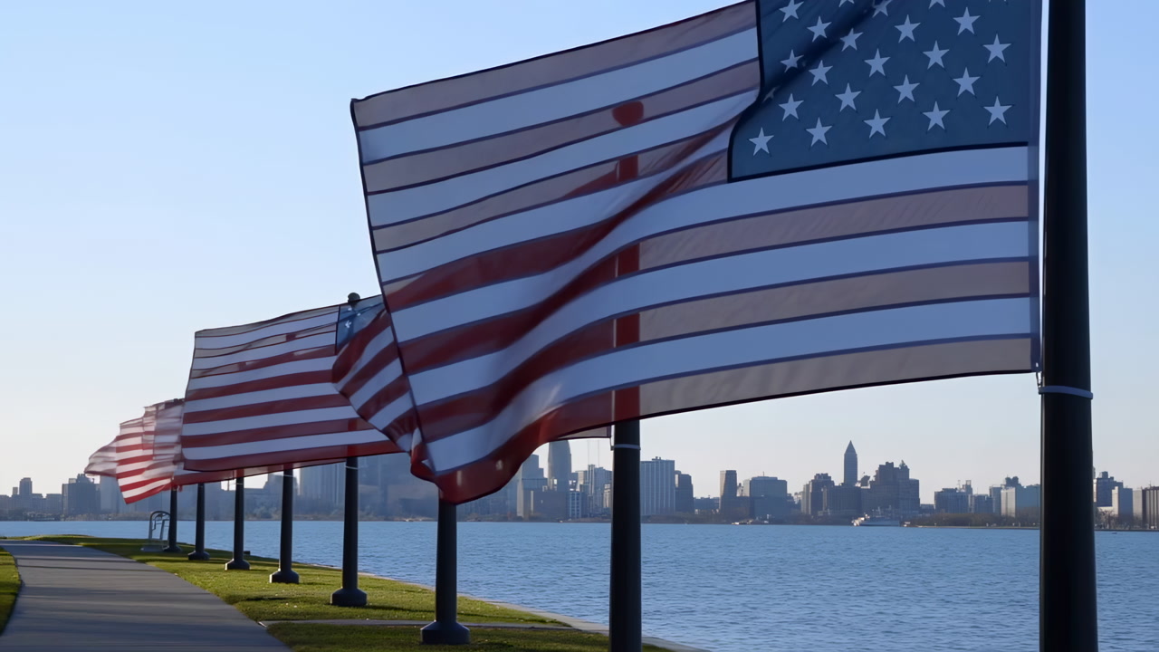 American Flags Along Waterfront Skyline Waving At Dawn Row Of Flags On Black Poles Lines Curved Promenade