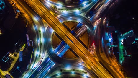 aerial view of traffic time lapse on intersection circle. busy traffic at night