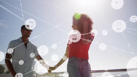 Animation-of-network-of-connections-over-happy-couple-on-the-beach