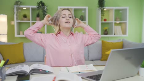 university student girl completes homework on laptop and relax.