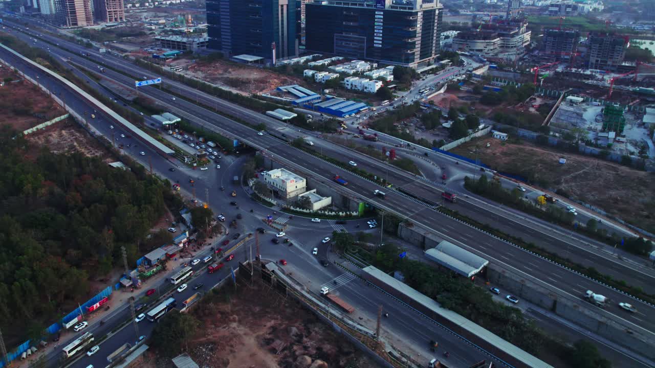 Financial district circle with orr exit No 1 and moving vehicles at Nanakramguda, Financial district, hyderabad, telangana, india. day time, push back, drone shot, 4k.