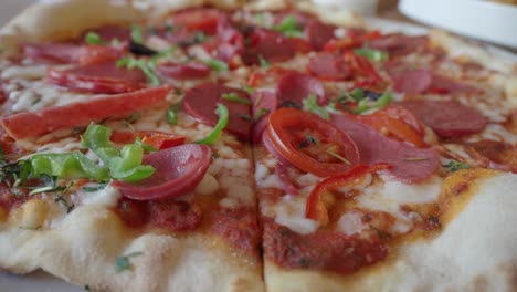 close up of pepperoni pizza with fresh toppings