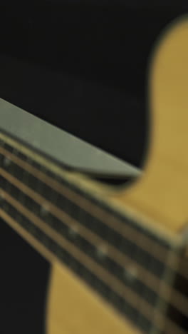 close-up of acoustic and bass guitar