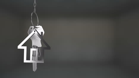 house-shaped keychain with keys hanging, animation over blurred background