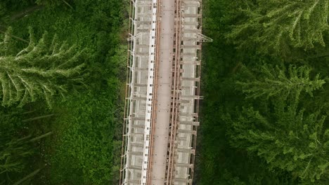 lowering top down aerial shot of the train tracks on ziemes valley bridge