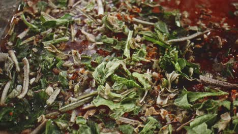 extreme close up of salt, paprika, garlic powder and rosemary, chopped carrots, cabbage and rice ready to make stew