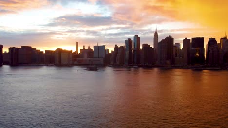sunset over new york city midtown, stormy sky