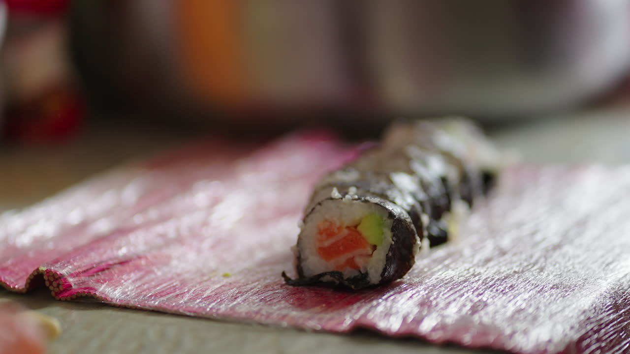 Homemade Salmon Sushi Rolls with Avocado Cut Into Bite-sized Portions. - closeup shot