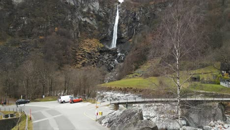 approaching drone shot of cascata di foroglio waterfall that flows down the river maggia, located in cavergno in the district of vallemaggia in switzerland