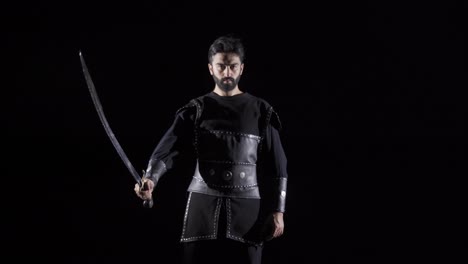 warrior in the historical period. black background.