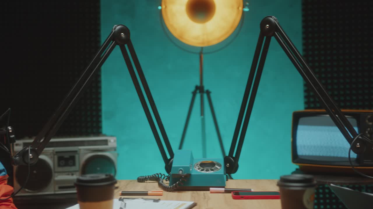 Stylish Woman Recording Podcast Interview with Female Guest in Studio