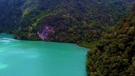 drone shot of a turquoise blue sea surrounded by a set of paradise islands in langkawi malaysia