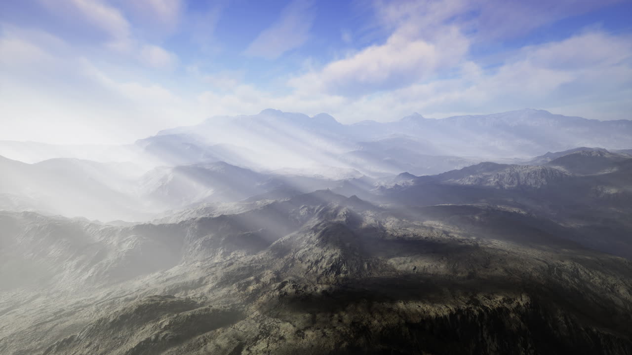 Majestic mountain landscape with mist and sunlight in open sky