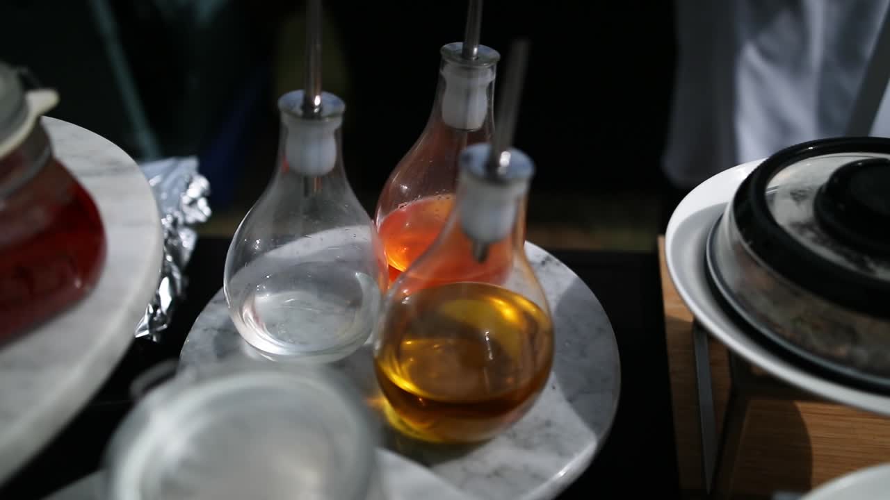 Bottles of oils on a buffet
