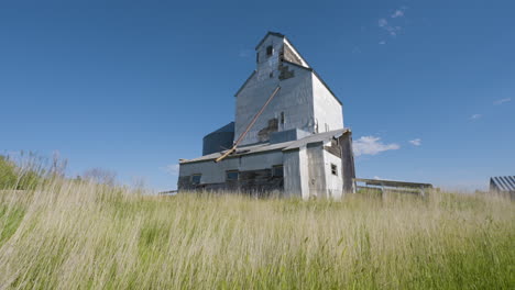 old grain elevator in a field