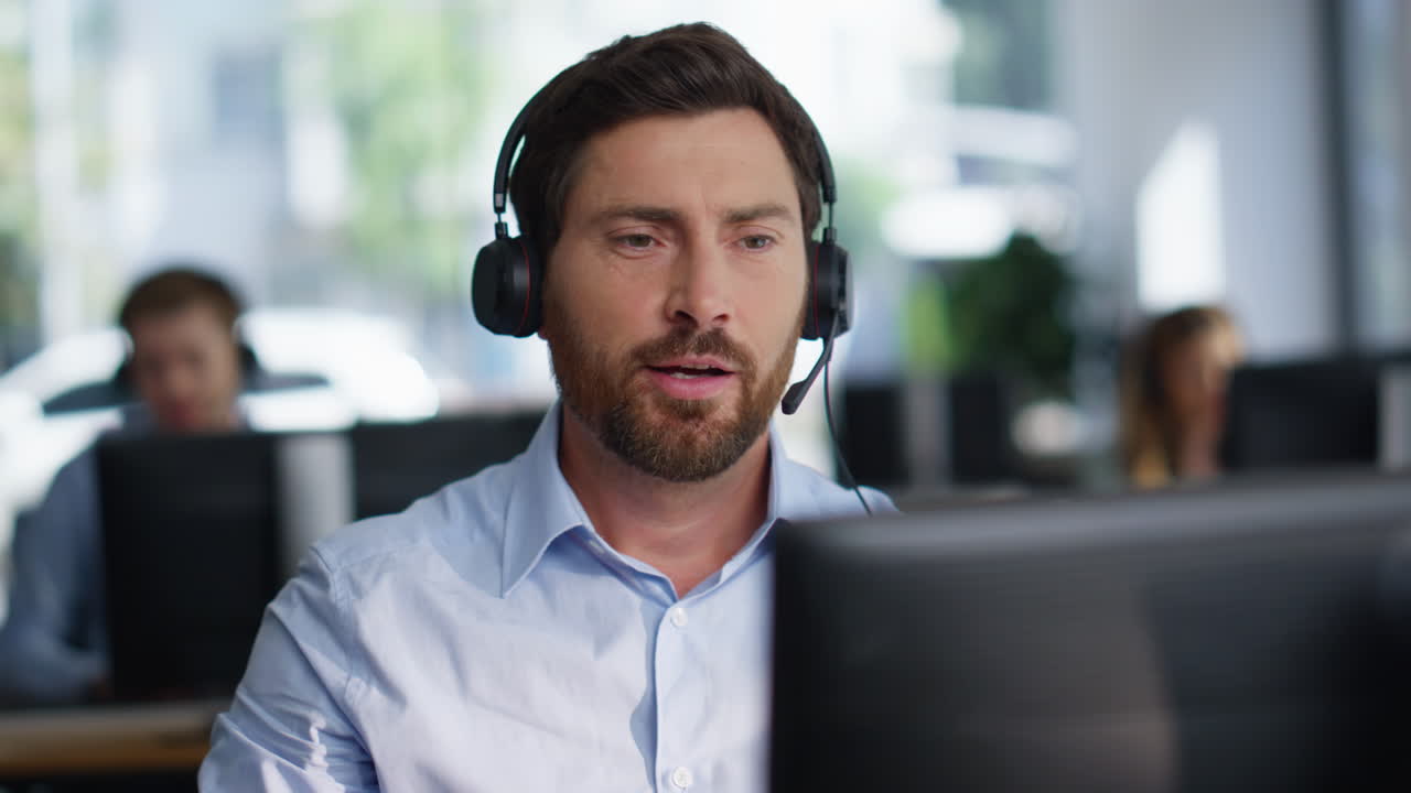 Helpline employee taking headphones from computer start consultation closeup