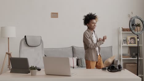 teenage boy filming dance on smartphone