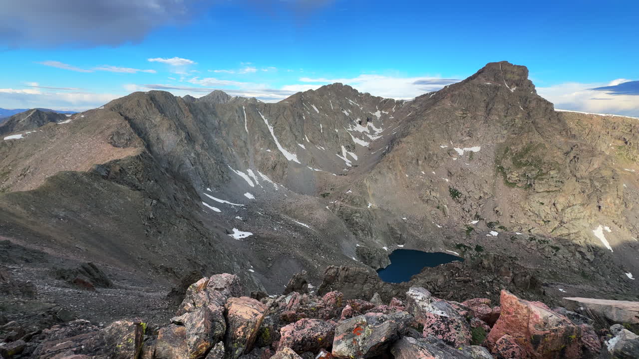 Halo Ridge Notch Mountain Shelter trail view of Mount of the Holy Cross Ridge saddle Peak 14er Colorado Sawatch Rocky Mountains Tear of Bowls Lake morning sunrise landscape blue skies clouds pan