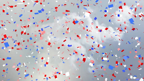 red, white, and blue confetti animation falling over cloudy sky background